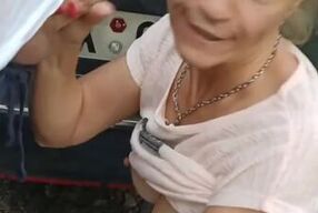 Milf sucking dick on the parking by the public road. Public cock sucking and cumshot on ground