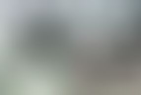 Patient lies naked on the couch while the doctor checks her holes