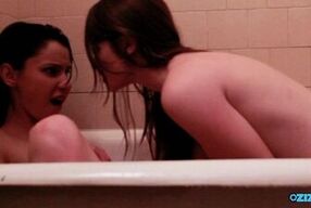Sticking a finger up her wet beaver as the bath sex gives these lesbians a thrill