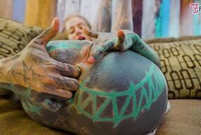 High-Heeled Tattooed Vixen Rubs One Out in Sheer White Lingerie