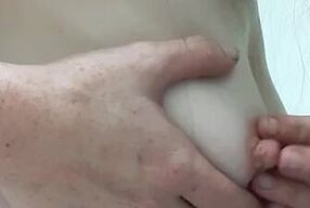 Small teen plays with pierced nipples