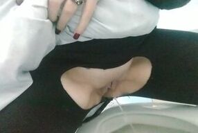 Pissing in a public bathroom